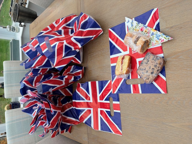 An images of the cakes and sausage roles with Union flags